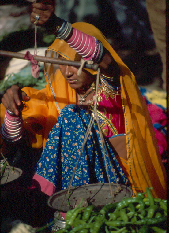 Woman with scales	Village market, India